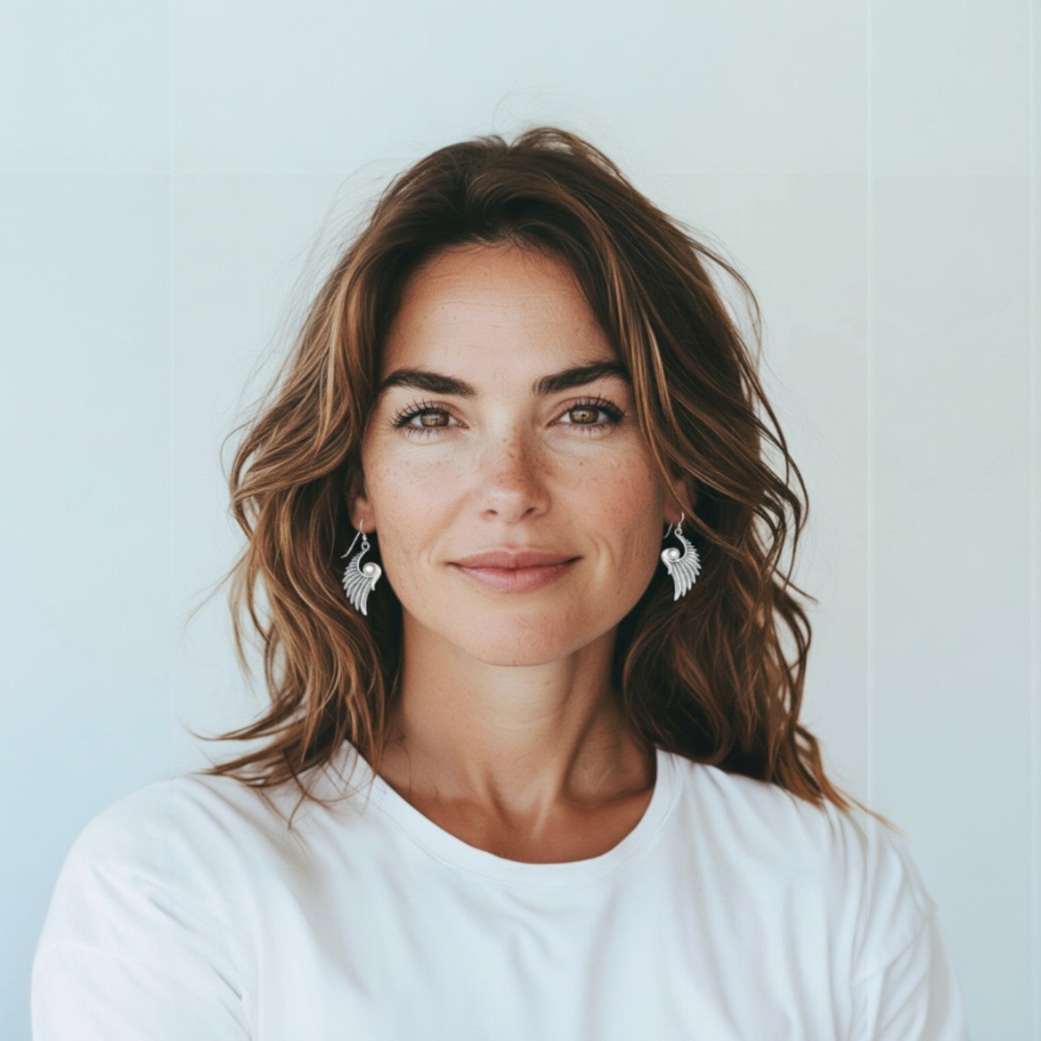 Wings of Grace – Sterling Silver Angel Wing Earrings